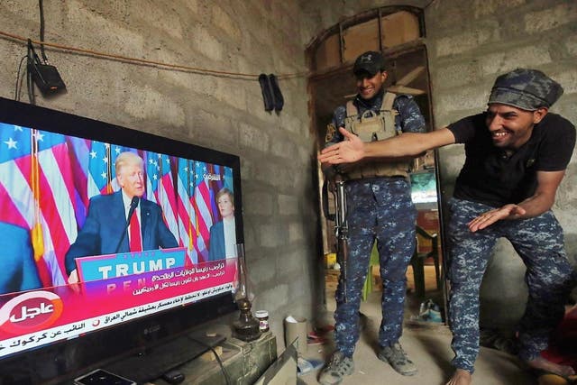 Iraqi troops watch Donald Trump's victory speech outside the Isis-held city of Mosul on Wednesday 9th November (Getty)