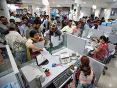 Indians scramble to deposit cash as government voids bank notes