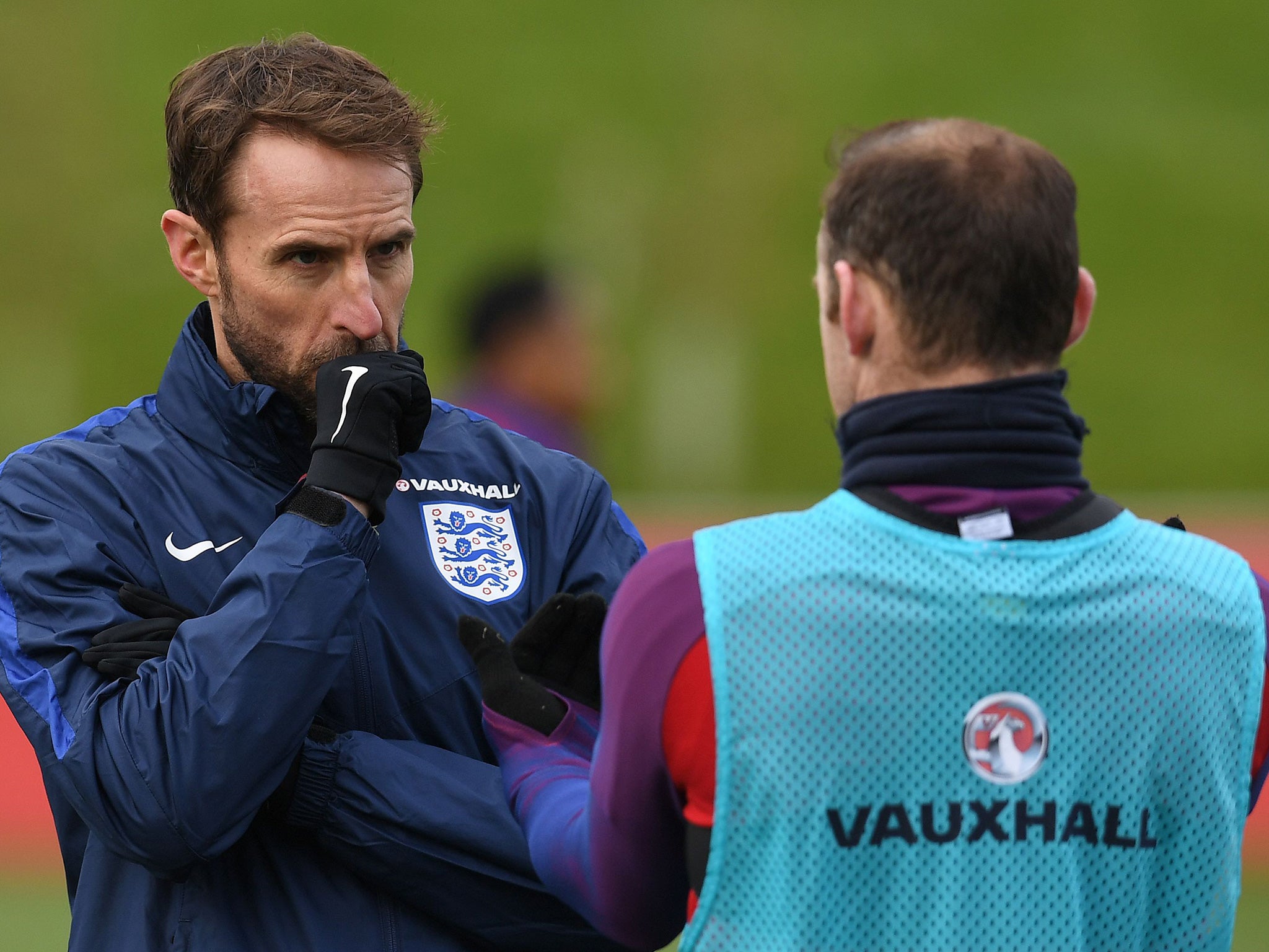 Southgate talks with Rooney during a training session at St George's Park