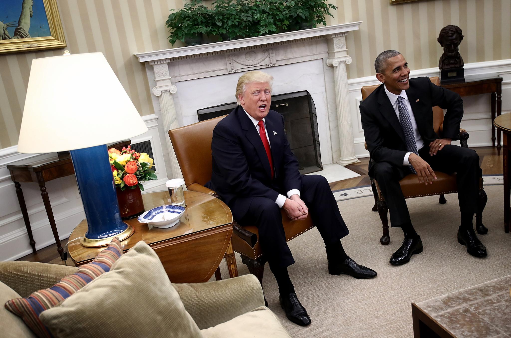 Donald Trump and Barack Obama enjoy a light-hearted exchange with journalists in the White House in December