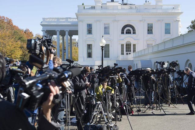 Members of the press await the arrival of US President-elect Donald Trump for a meeting with US President Barack Obama at the White House