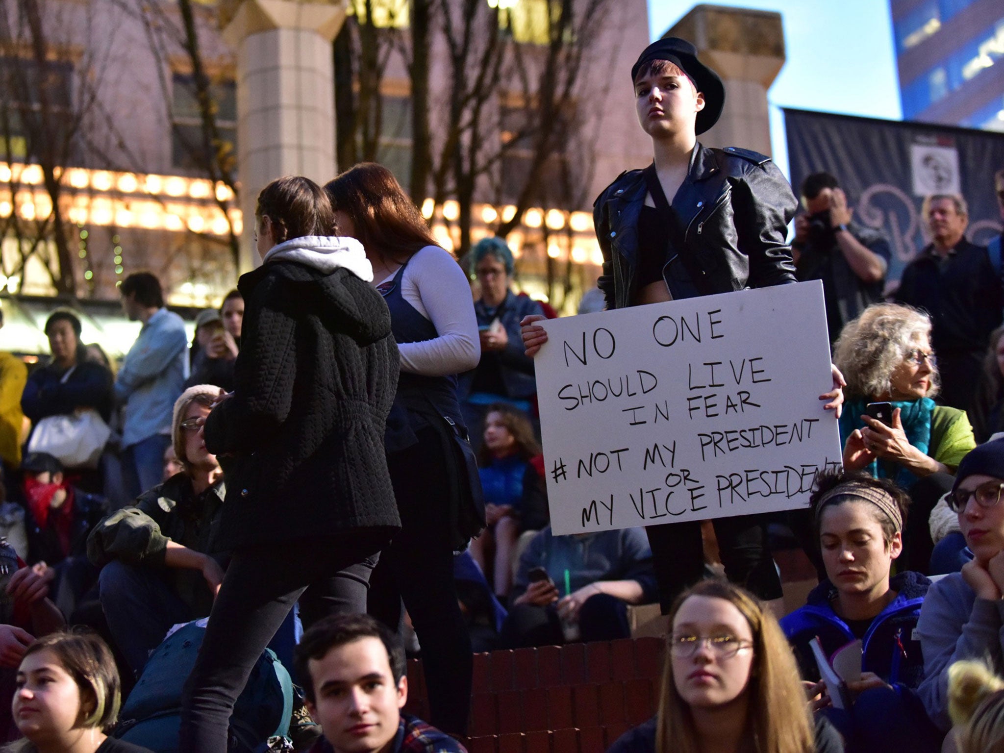 Protesters gather in Pioneer Courthouse Square in Portland, the third night of protests over the results of the presidential election, on 10 November 2016.