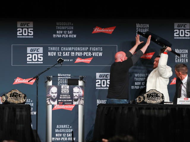 Conor McGregortries to throw a chair at Eddie Alvarez during their UFC 205 press conference