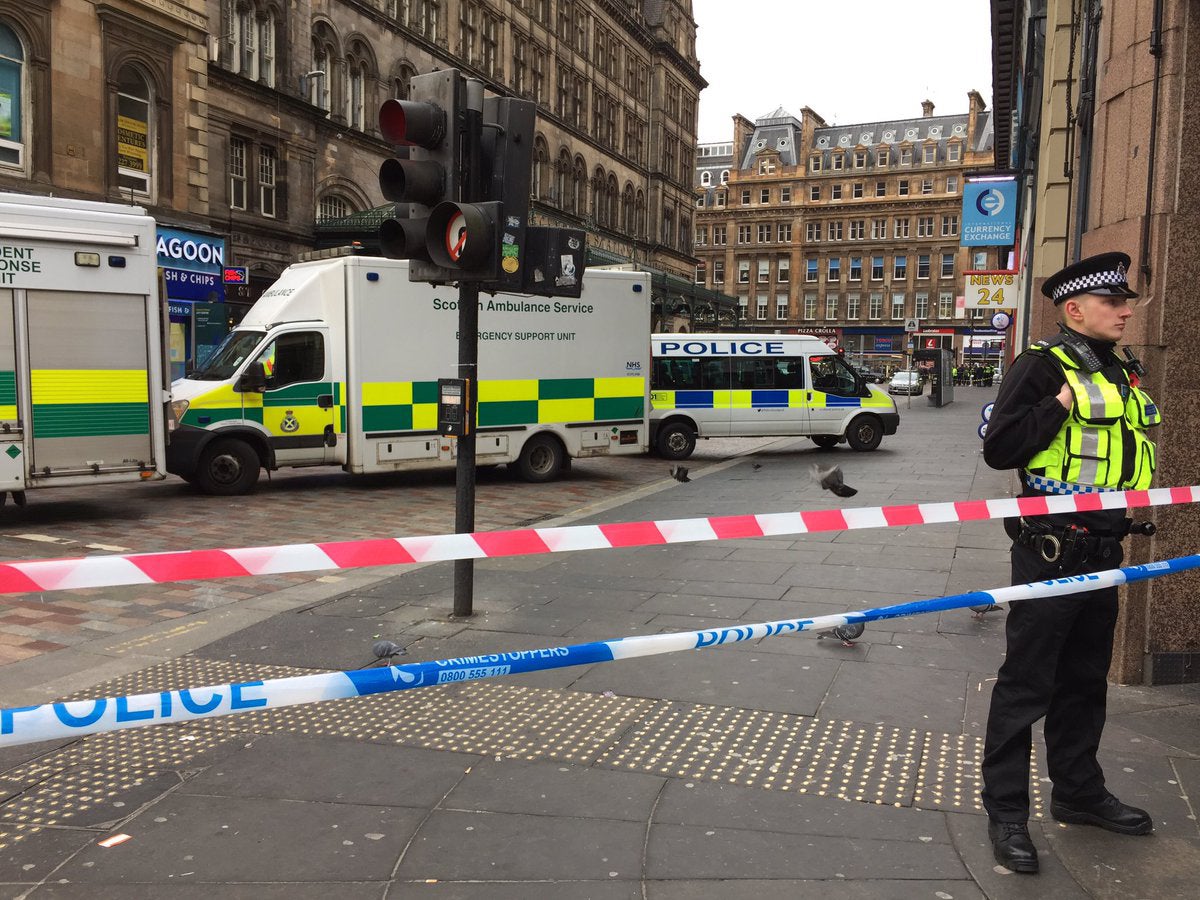 Police outside Glasgow Central Station after a man fell from a window