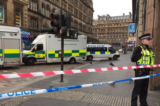 Police outside Glasgow Central Station after a man fell from a window