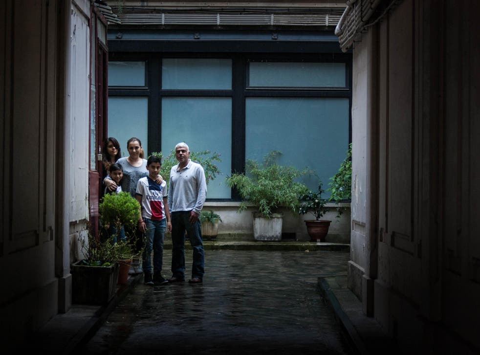 Gabriel, Natalia, Laetitia, Lionel and Noa Syed stand outside in the courtyard of their home, where scores of injured victims sought refuge and underwent treatment after escaping from the Bataclan on 13 November 2015