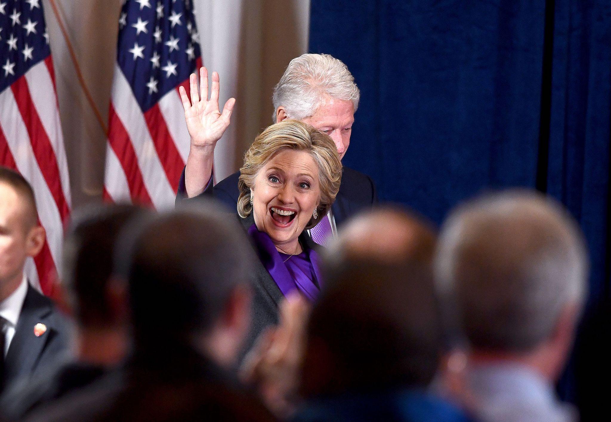 US Democratic presidential candidate Hillary Clinton is accompanied by her husband and former president Bill Clinton as she arrives to make a concession speech after being defeated by Republican president-elect Donald Trump, in New York on November 9, 201
