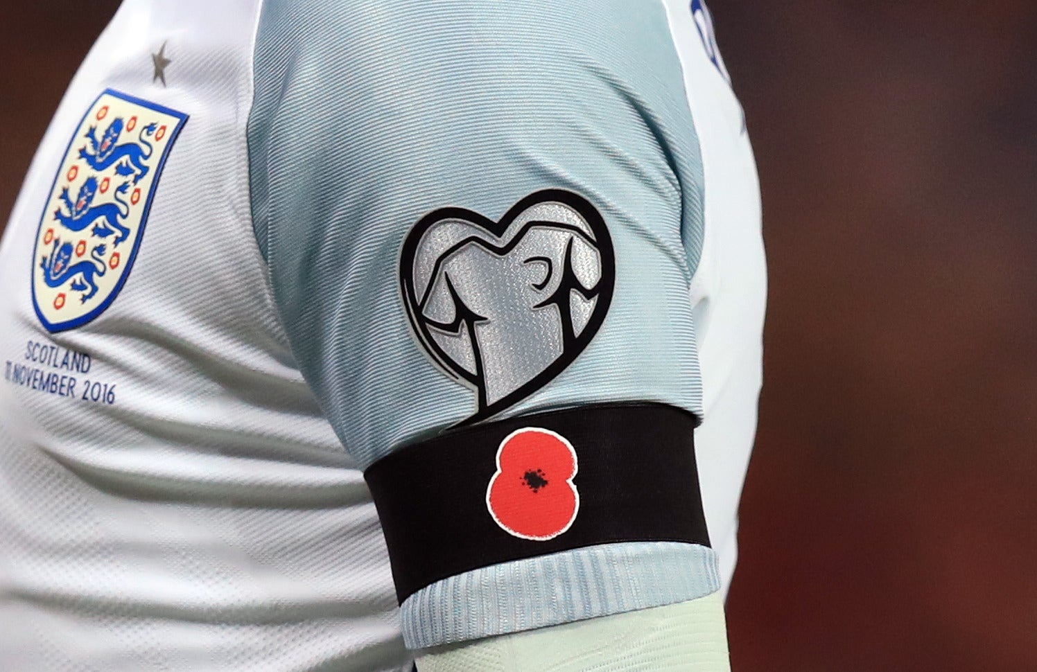 A detailed view of Wayne Rooney's black armband with a poppy on during the 2018 Fifa World Cup qualifier on Friday