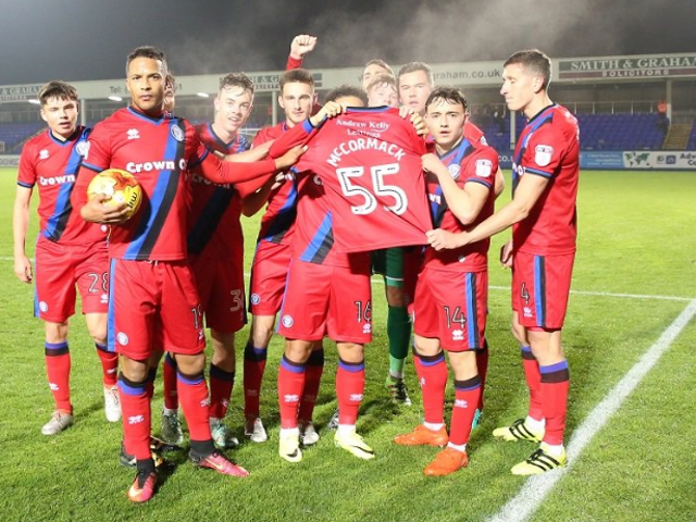Rochdale players held up Joshua McCormack's shirt after the game