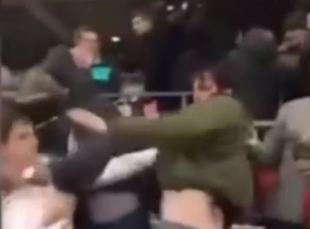 A man was left bloodied following this post-match brawl in Wembley stadium