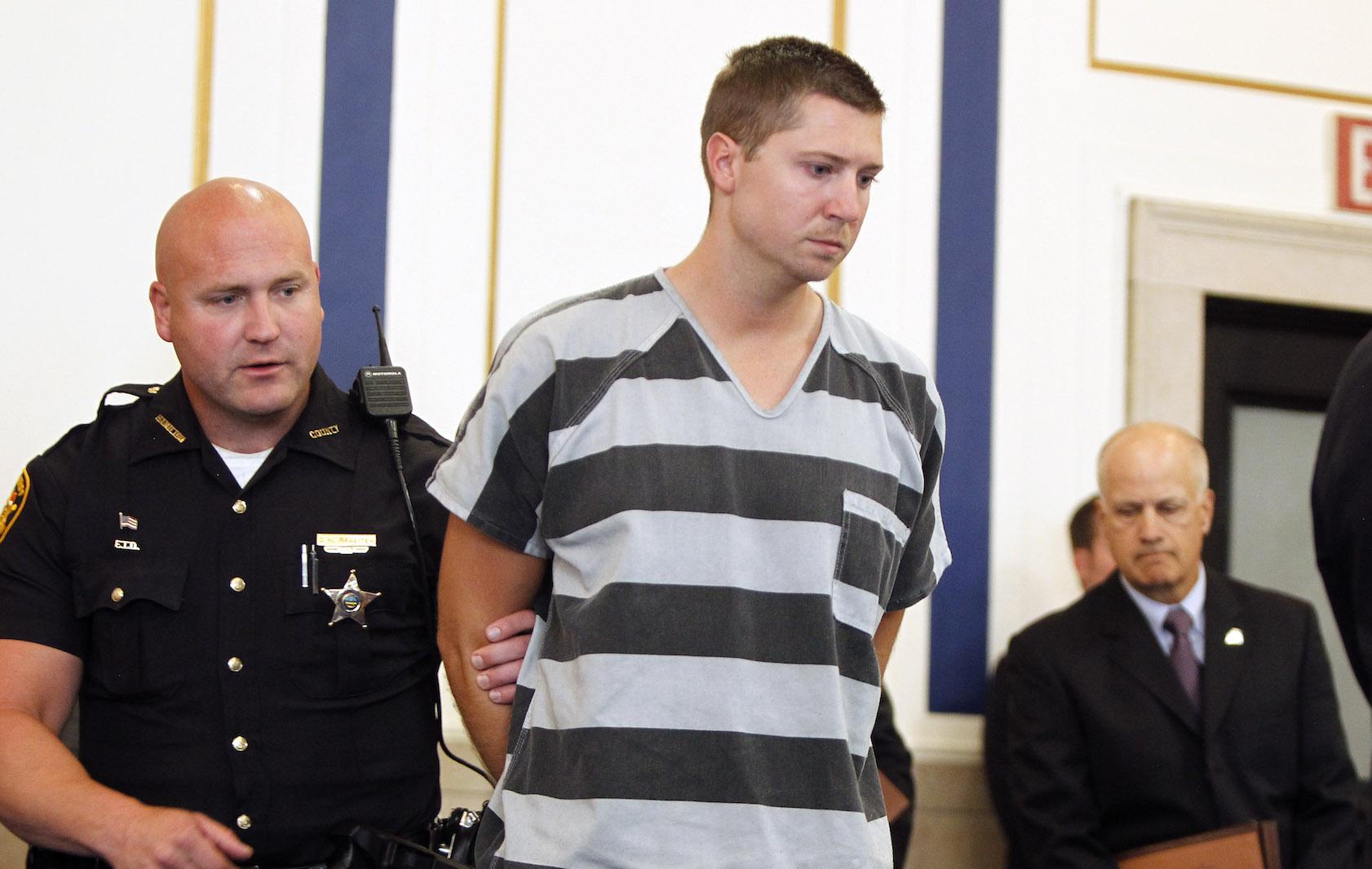 Former University of Cincinnati police officer Ray Tensing enters Hamilton County Common Pleas Court to be arraigned on murder charges July 30, 2014 in Cincinnati, Ohio. Tensing pleaded not guilty in the shooting death of Samuel Dubose during a routine traffic stop on July 19. Bond was set at $1 million.