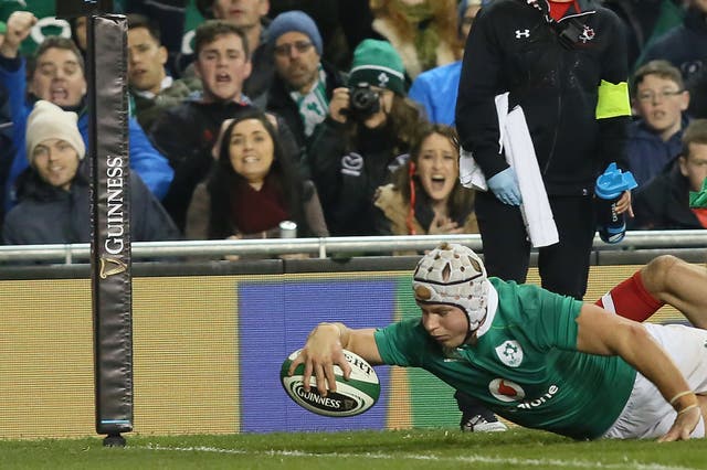 Luke Marshall reaches out to touch down and score Ireland's second try