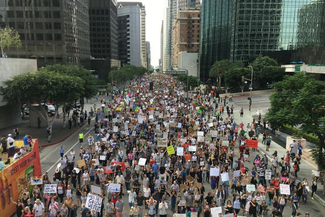 Police estimated at least 8,000 people marched in opposition to Donald Trump in Los Angeles on Saturday