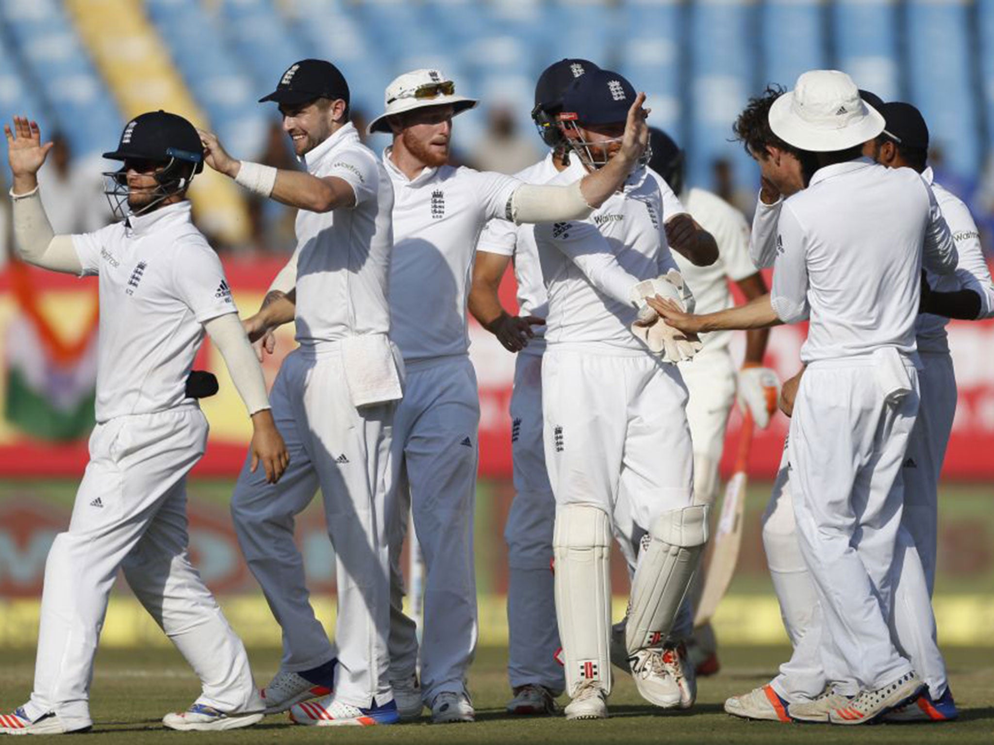 England celebrate taking the wicket of Ravichandran Ashwin