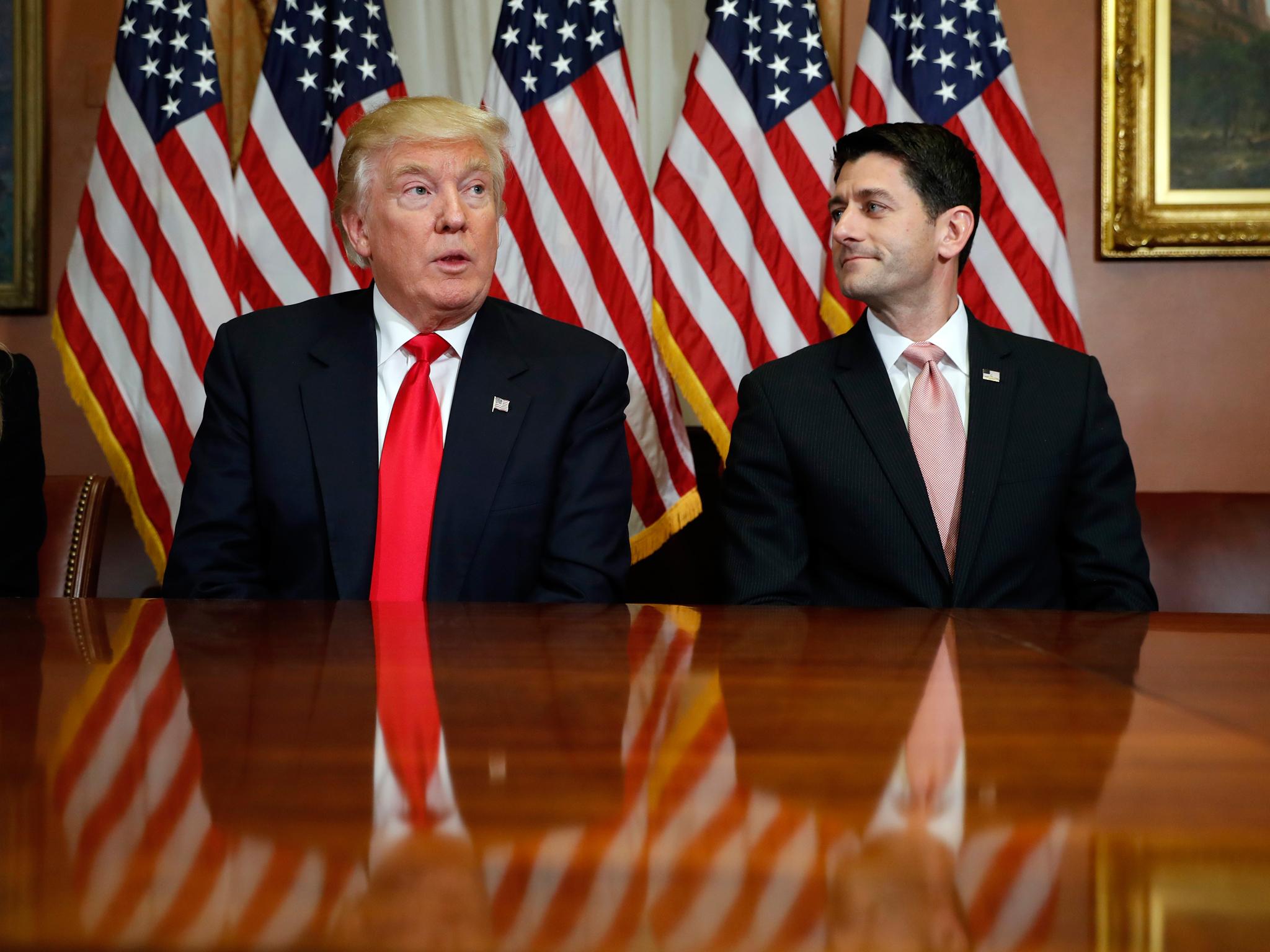Republican House Speaker Paul Ryan (right) said Mr Trump had 'earned a mandate' despite losing the popular vote
