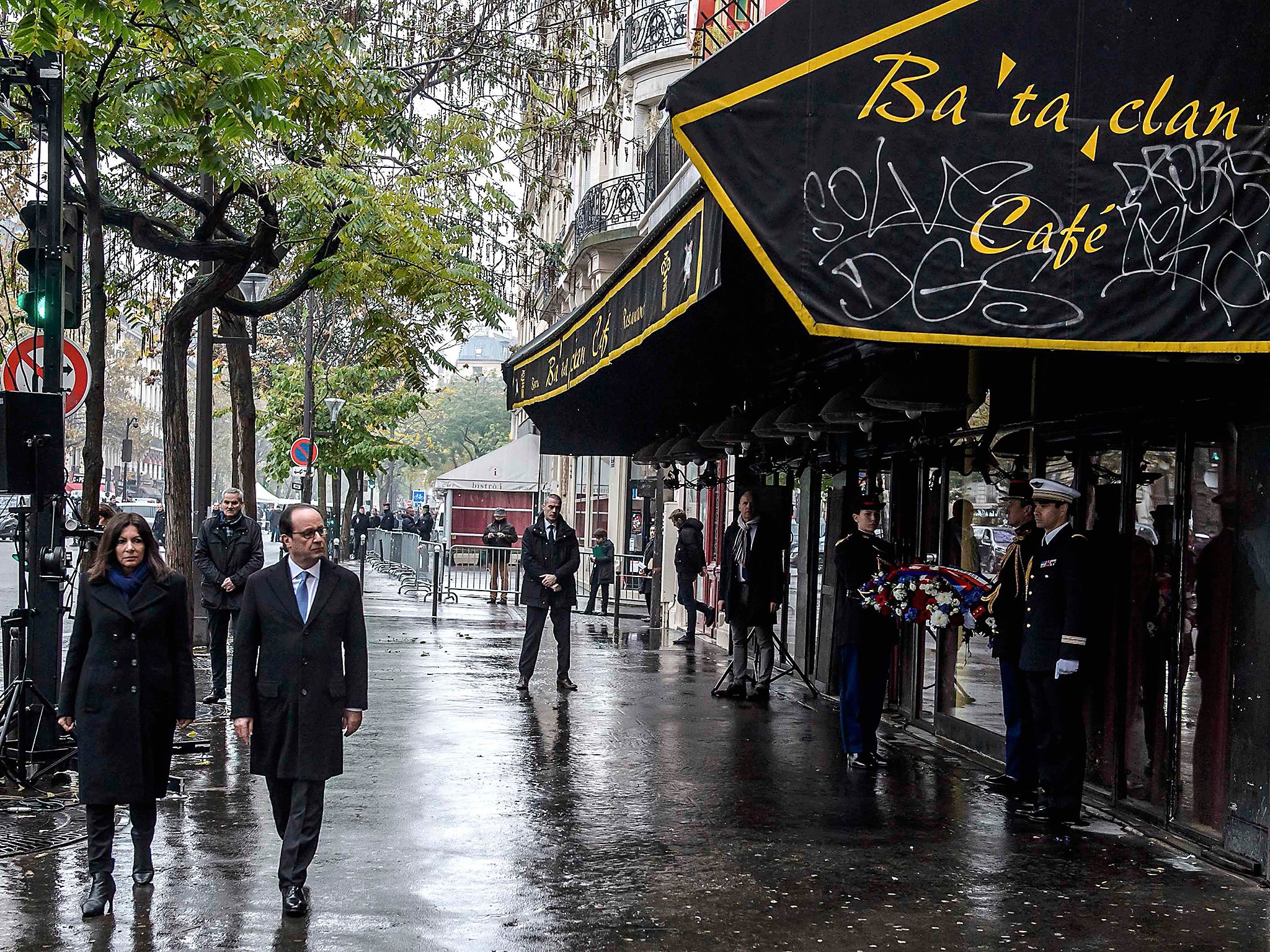 French President Francois Hollande and Paris Mayor Anne Hidalgo arrive to unveil a commemorative plaque in front of the Bataclan concert hall, in Paris, France