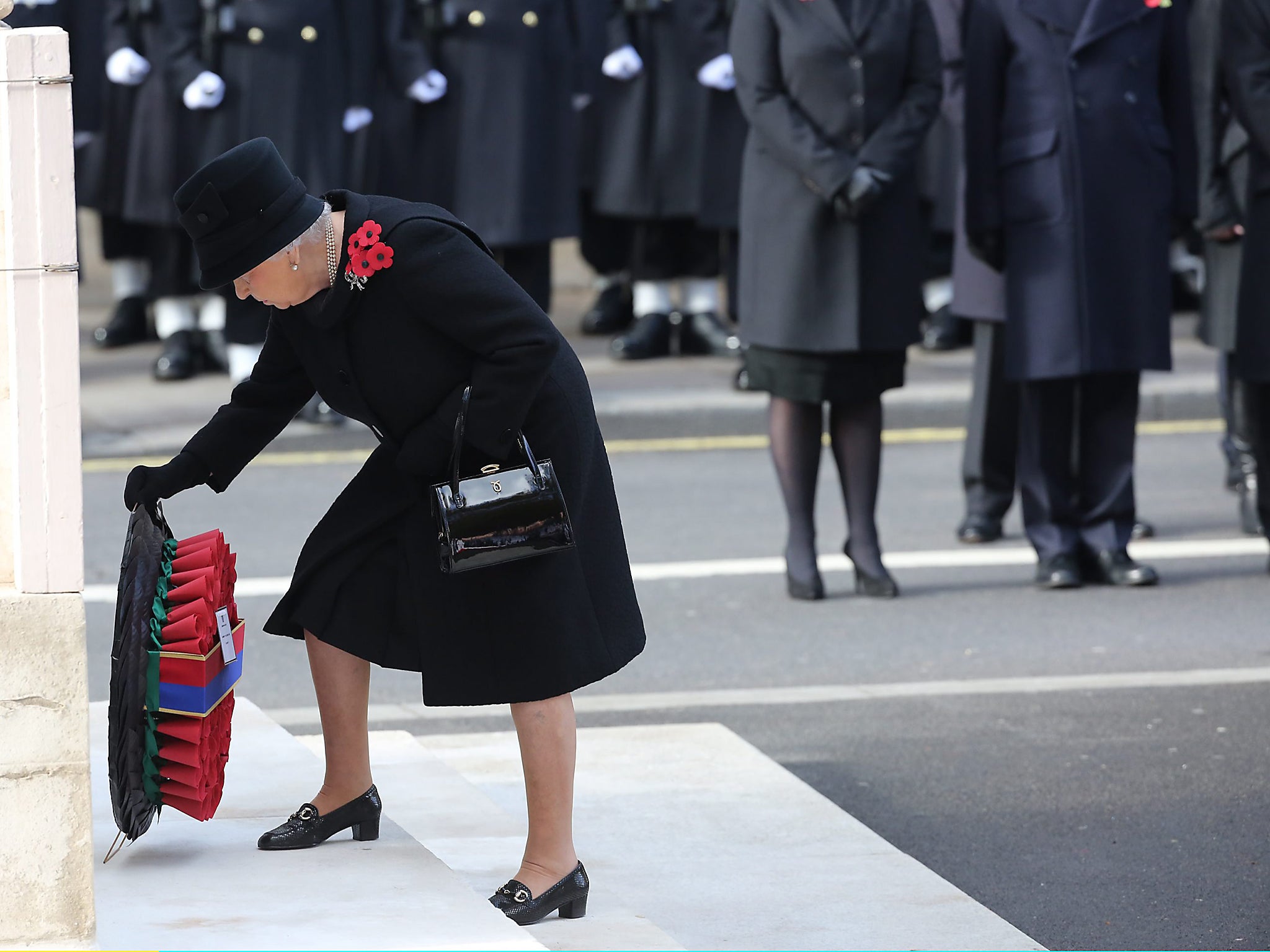 Queen Elizabeth II lays a wreath during the 2016 Remembrance Sunday Service at the Cenotaph on Whitehall in London