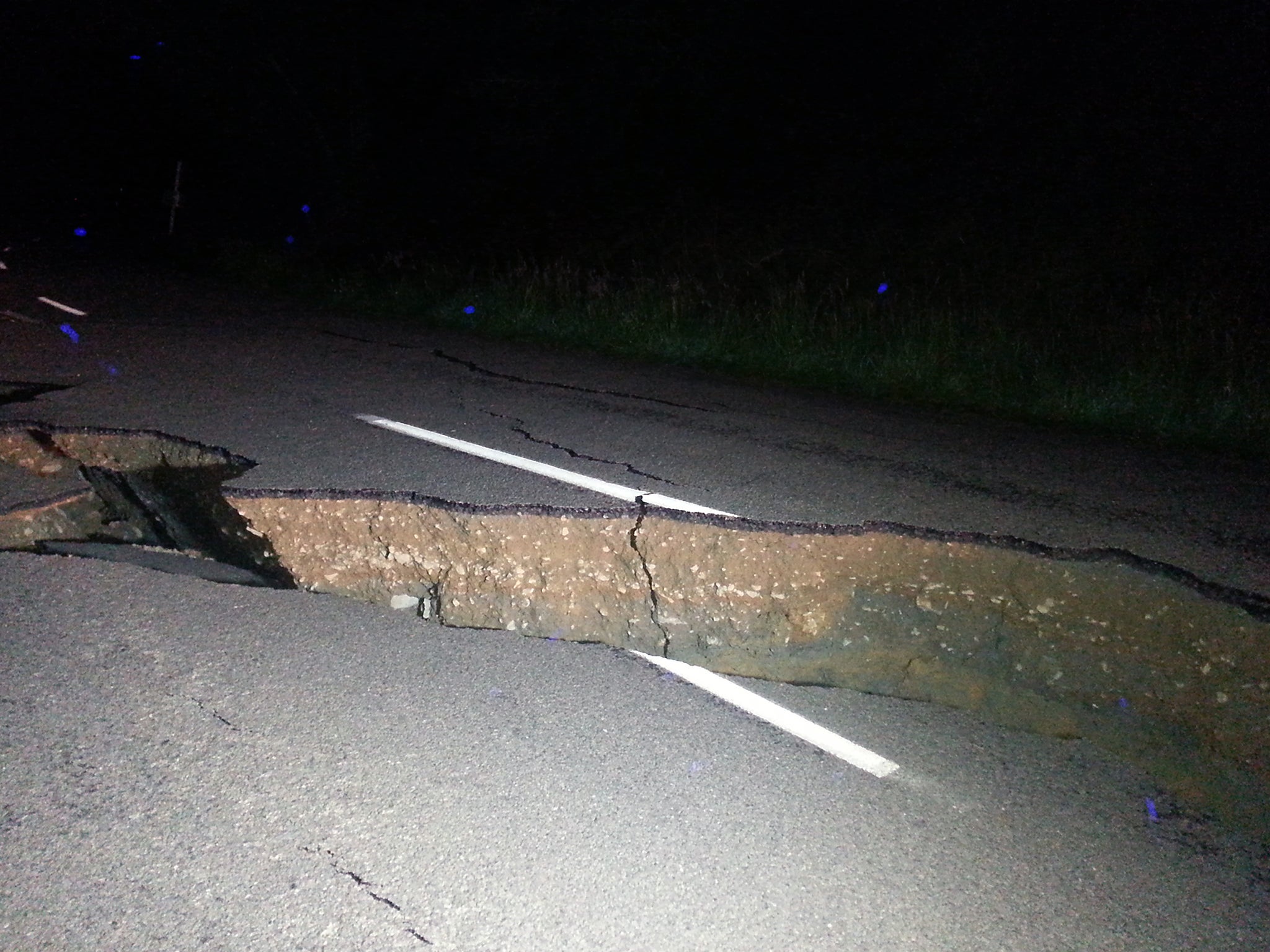 A large crack runs along Kaikoura Road about two hours north of Christchurch, after a major earthquake struck New Zealand