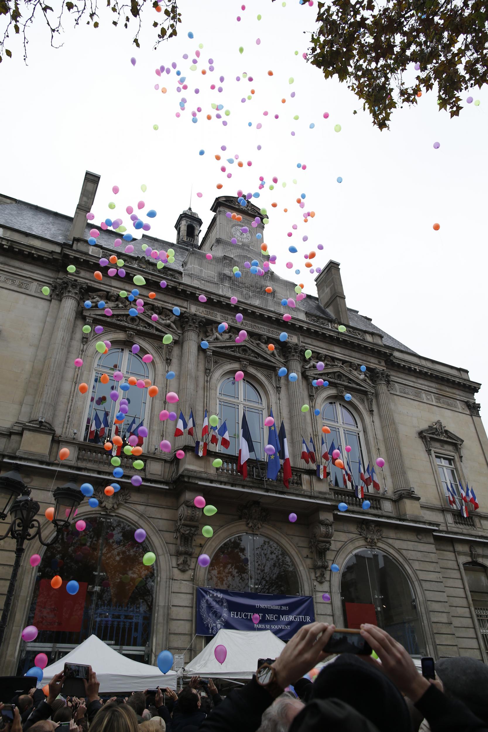 Balloons are released in front of Paris 11th district town hall, France, November 13, 2016, during a ceremony held for the victims of last year's Paris attacks which targeted the Bataclan concert hall as well as a series of bars and killed 130 people