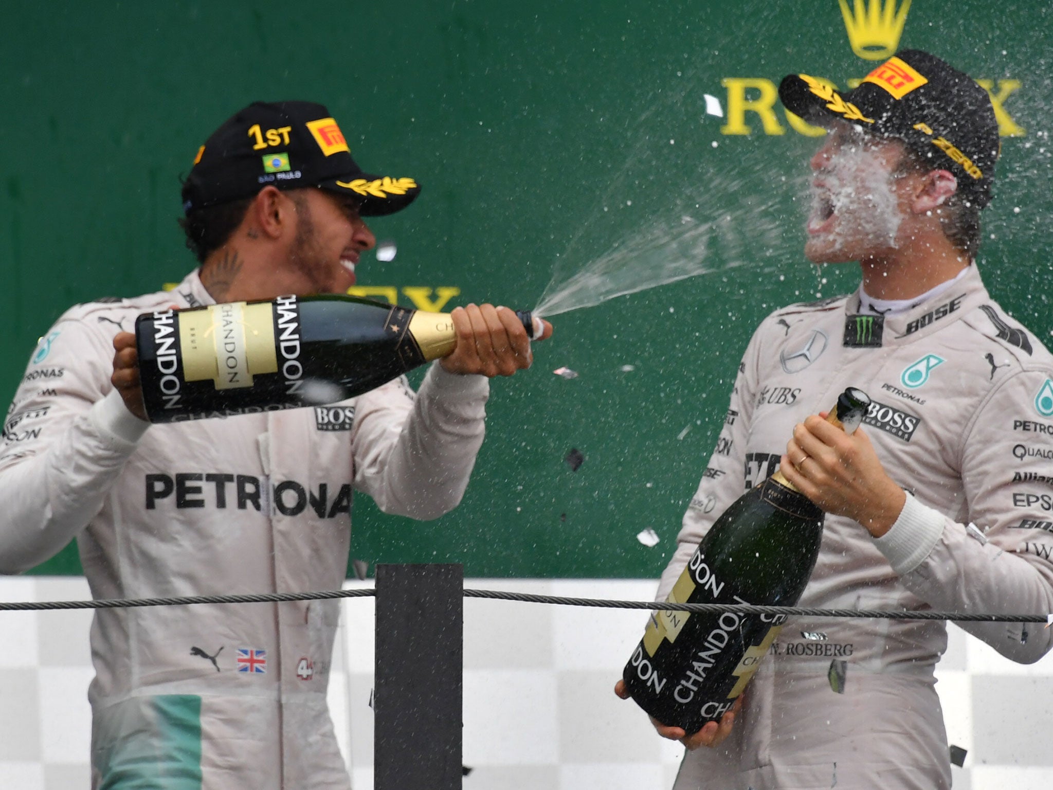 Hamilton celebrates with Rosberg on the podium