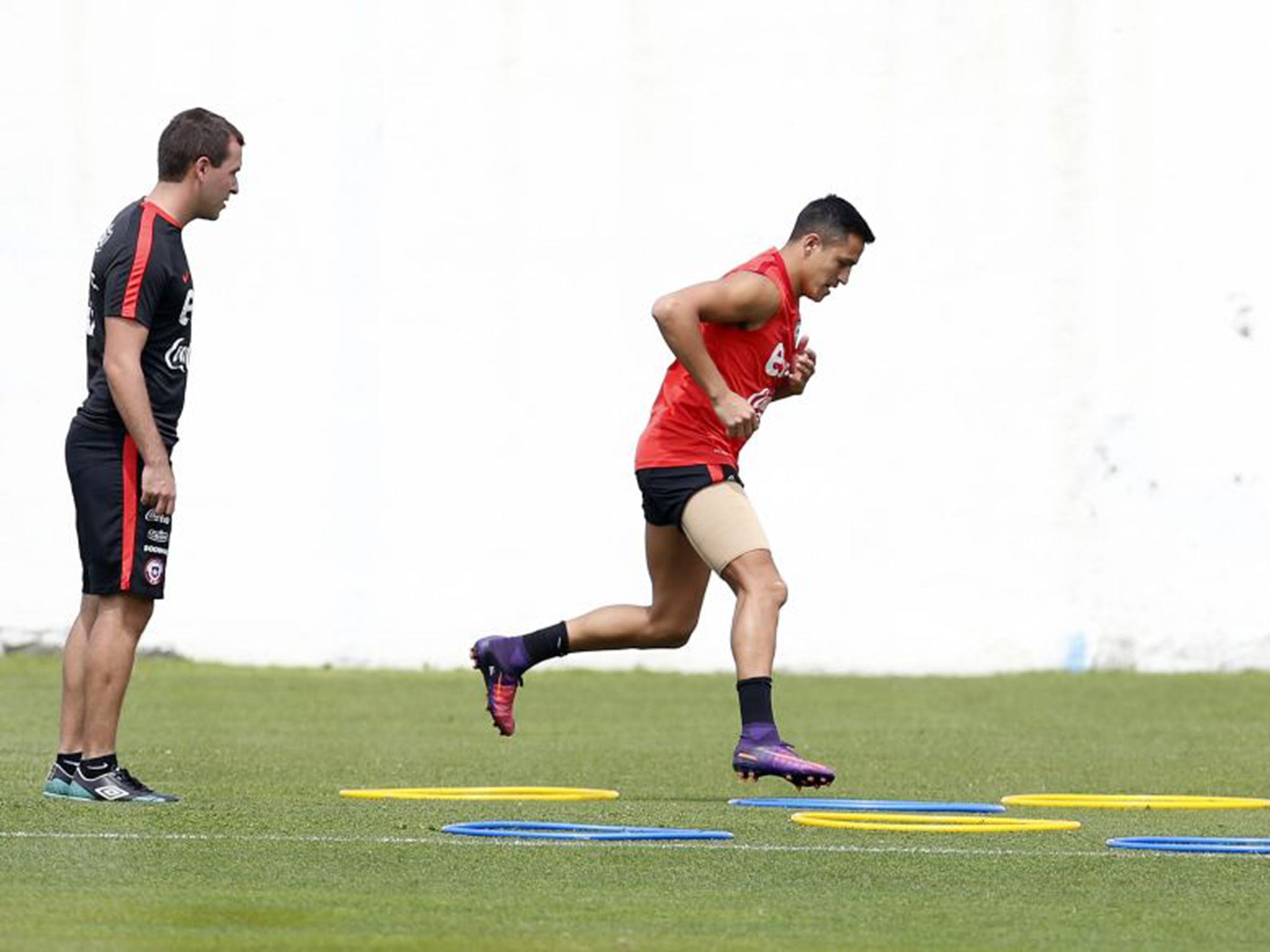 Sanchez in training with Chile while wearing a bandage on Sunday