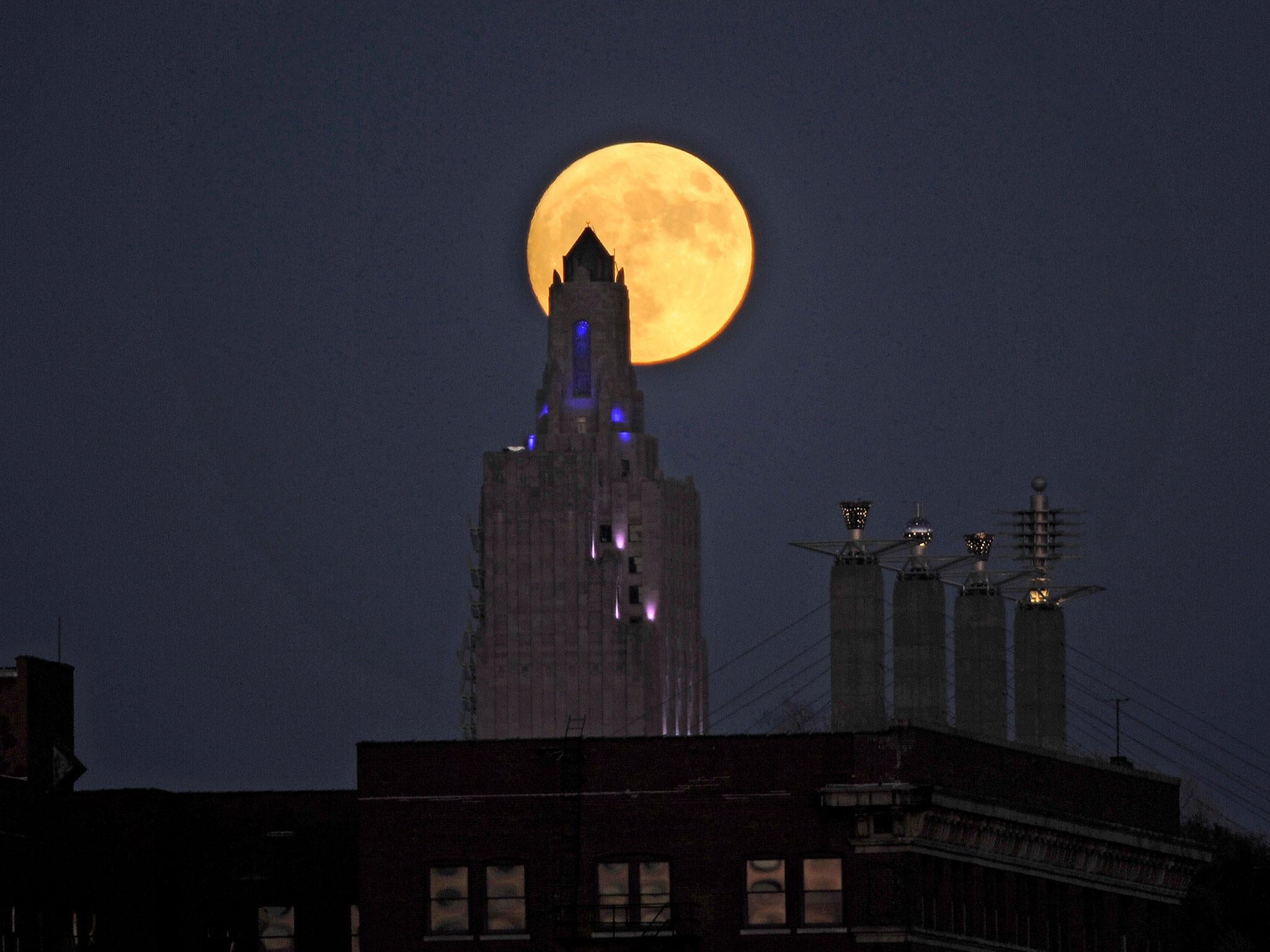 The "supermoon", the closest the moon comes to Earth since 1948, rises over the Power and Light building in downtown Kansas City, Missouri, U.S., November 13, 2016
