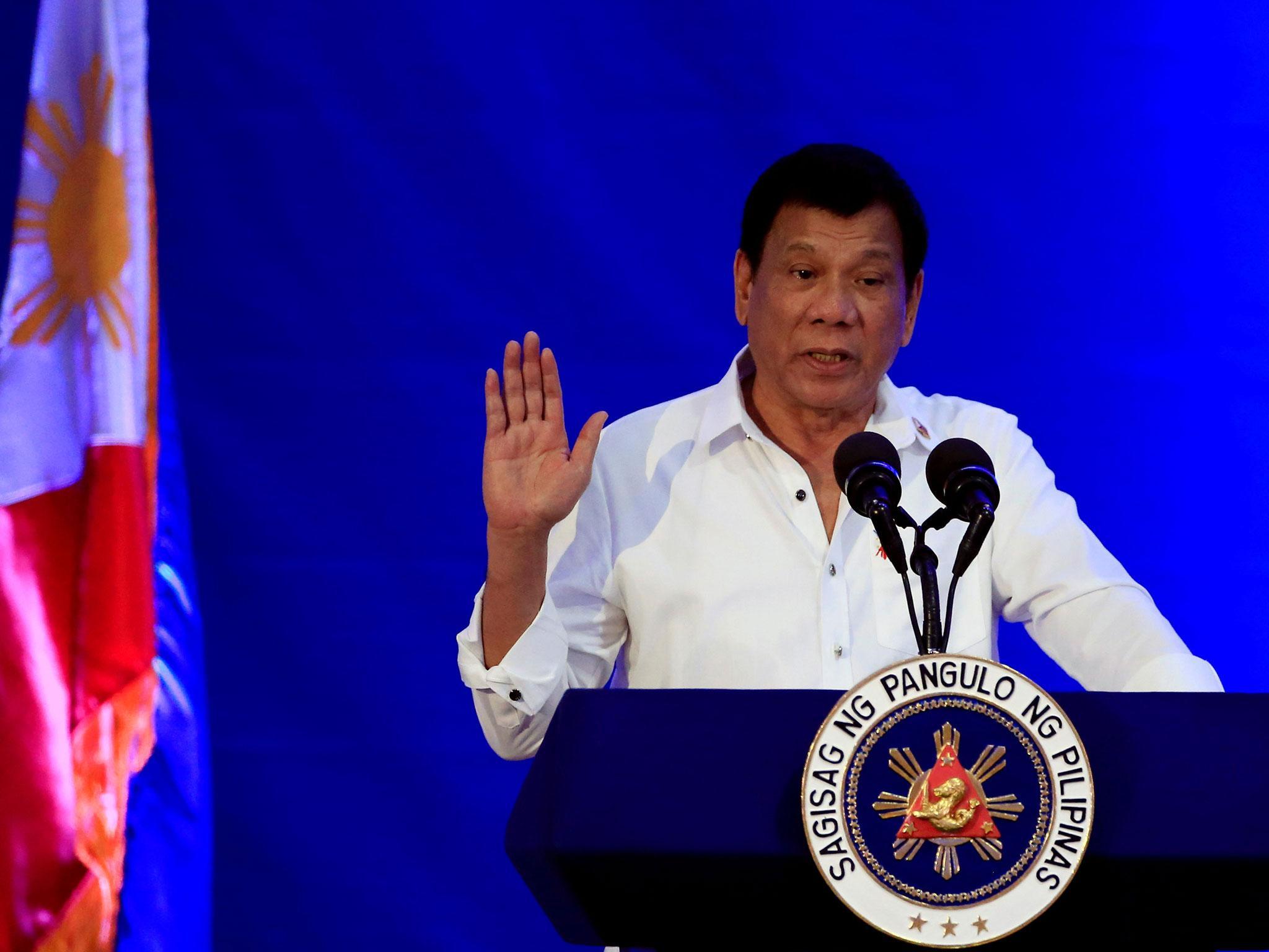 Philippine President Rodrigo Duterte delivers a speech pledging to ignore human rights if terrorists fighting in the Middle East return to the Philippines