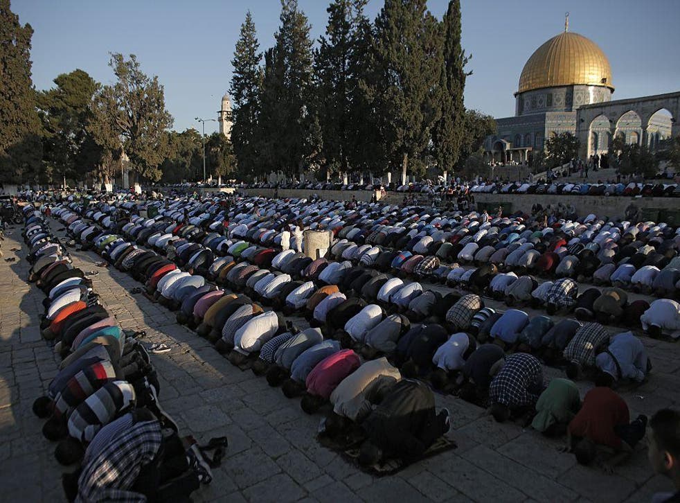 Palestinian Muslim worshippers praying at the al-Aqsa Mosque compound in Jerusalem’s old city