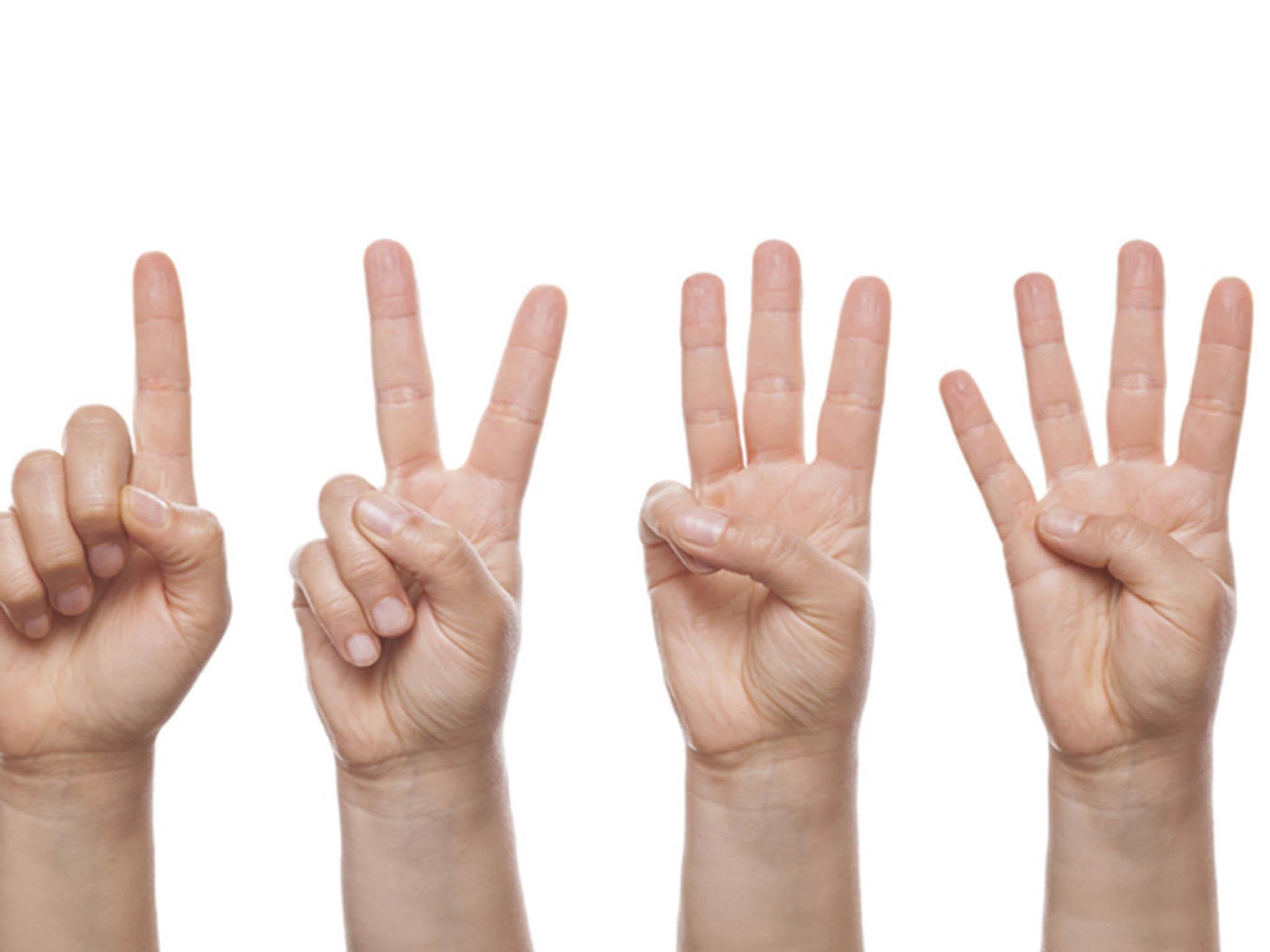 It's not a sign of mental deficiency, counting with your hands is actually a sign of cognitive ability