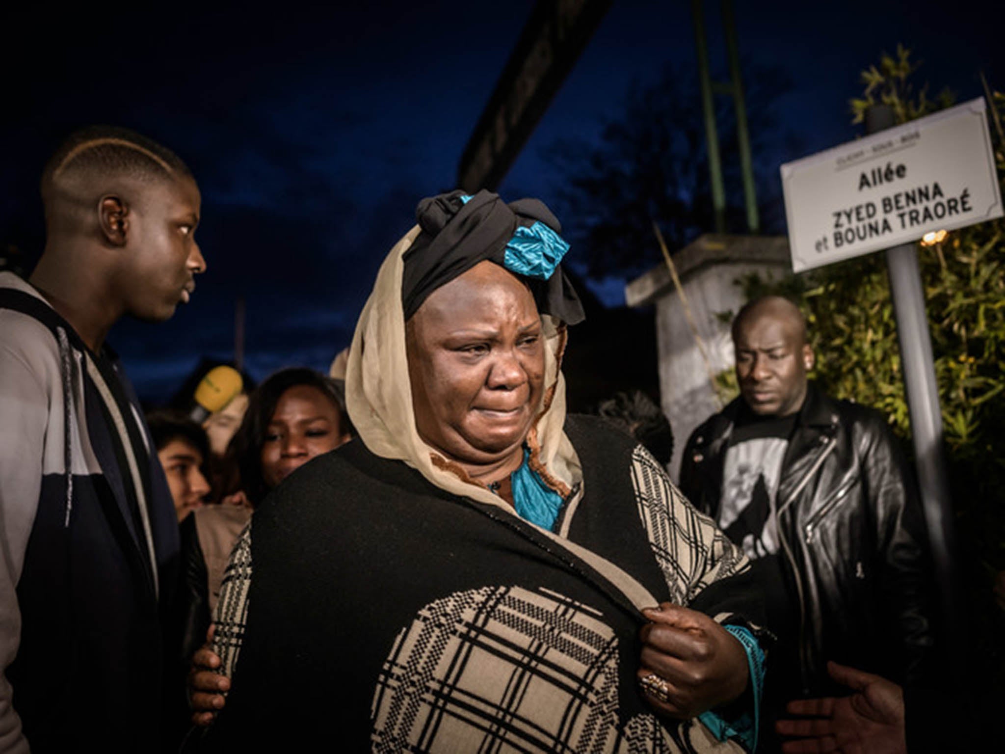 Relatives of Bouna Traore who died in an incident which sparked the 2005 Paris riots, inaugurate a street sign ten years later