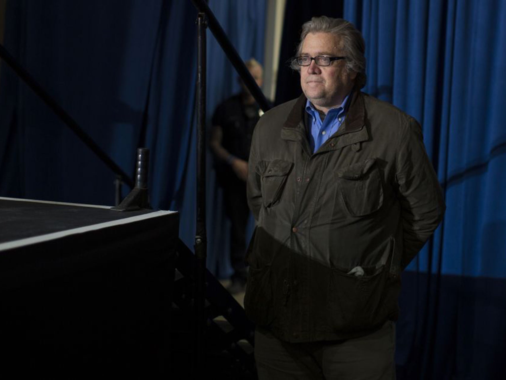 Steve Bannon looks on as Donald Trump speaks during a campaign rally earlier this month