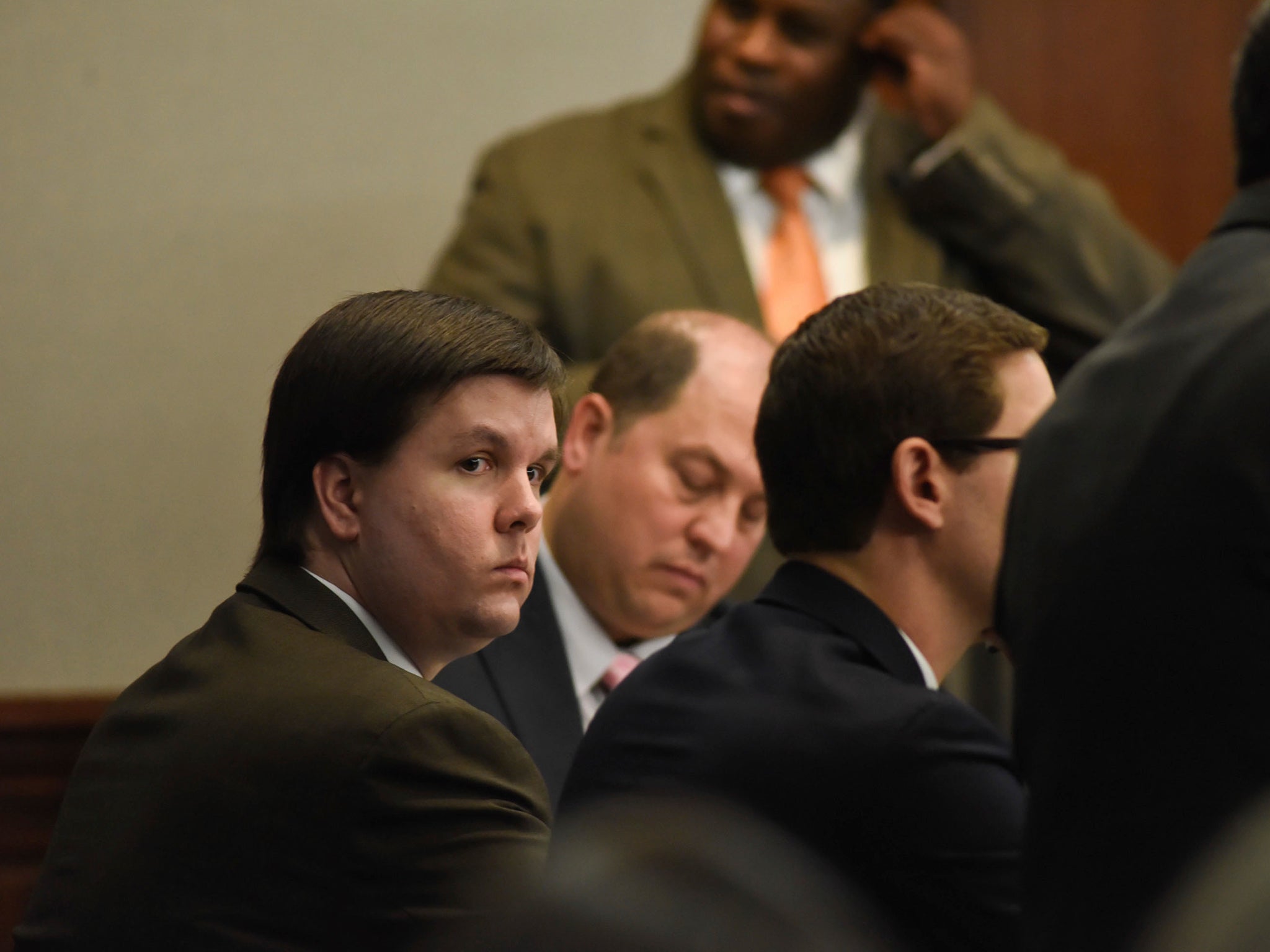 Justin Ross Harris sits with his defence team in the Glynn County Courthouse in Brunswick, Georgia
