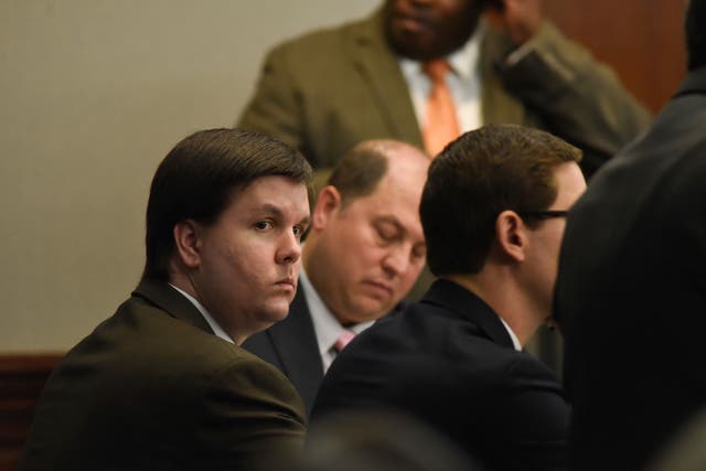 Justin Ross Harris sits with his defence team in the Glynn County Courthouse in Brunswick, Georgia
