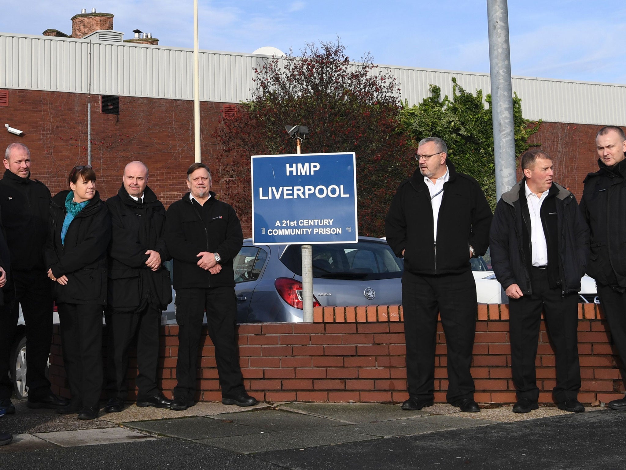 Members of the prison service gather outside HMP Liverpool,