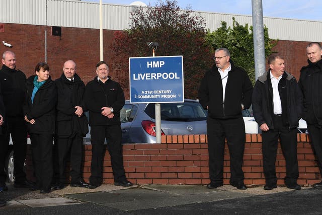 Members of the prison service gather outside HMP Liverpool,