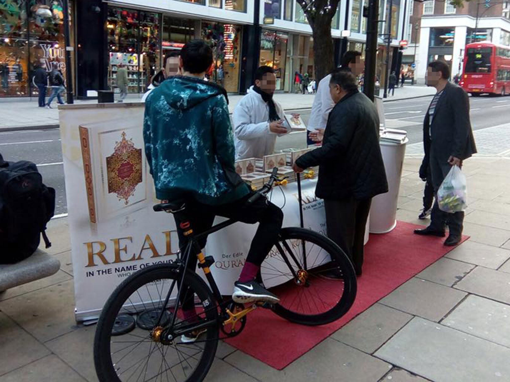 Members of the Read! Quran UK project at a stall in Oxford Street, London, on 13 November