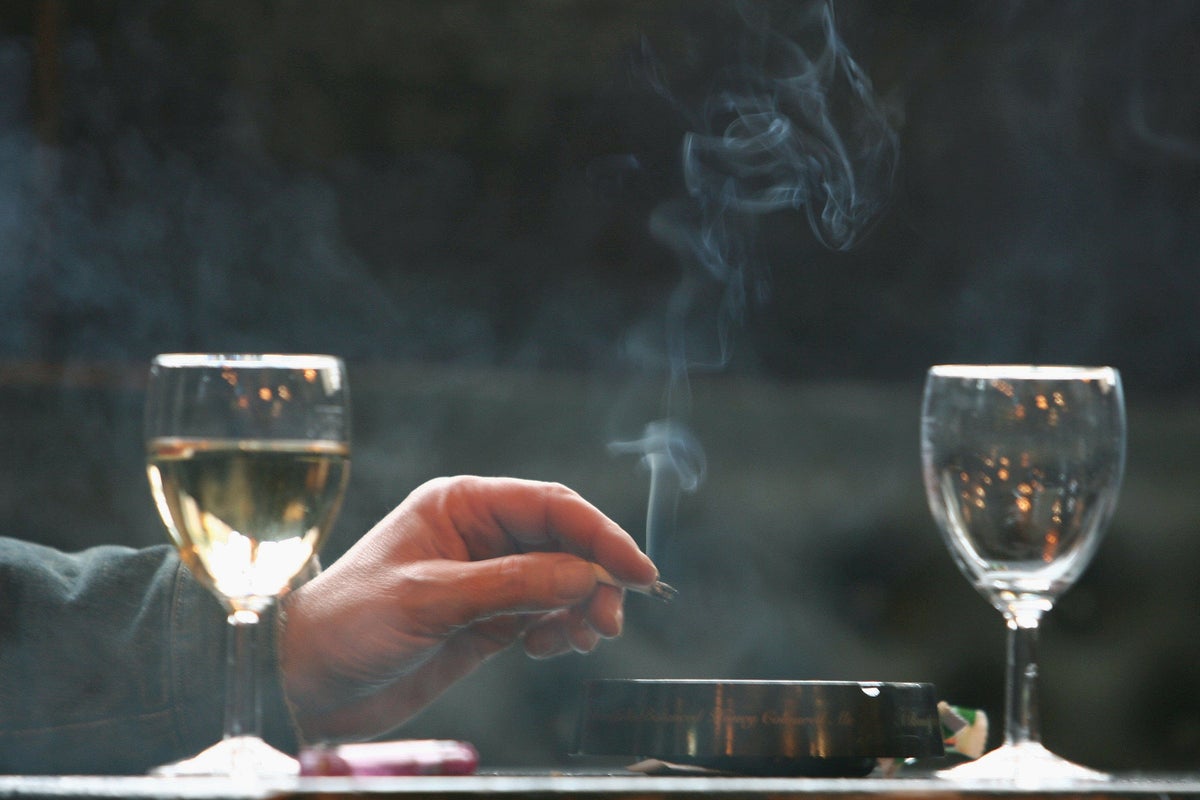 Glass of wine before cigarette 'can prevent damage' | The Independent