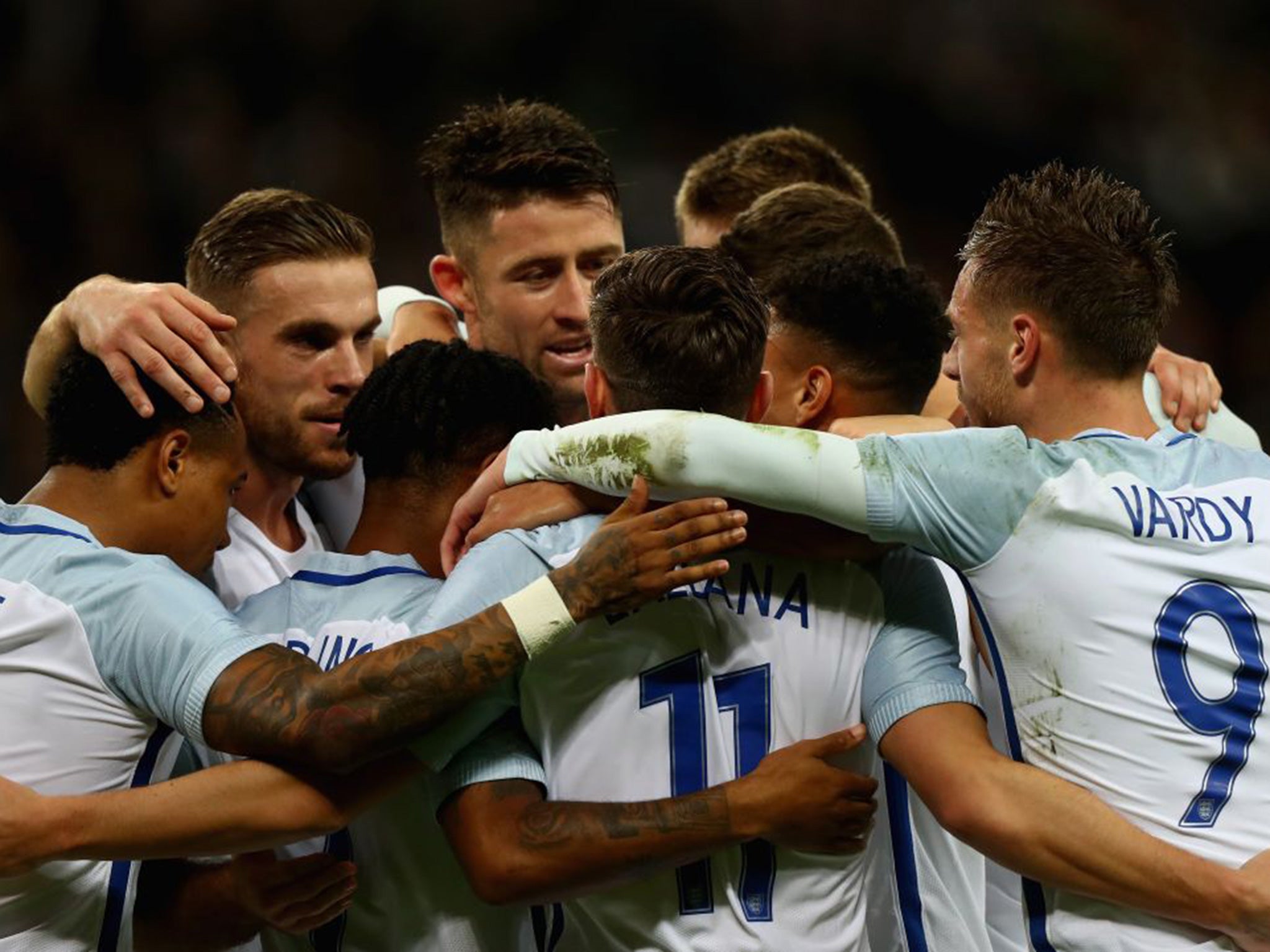 England celebrate going ahead through Lallana's early penalty