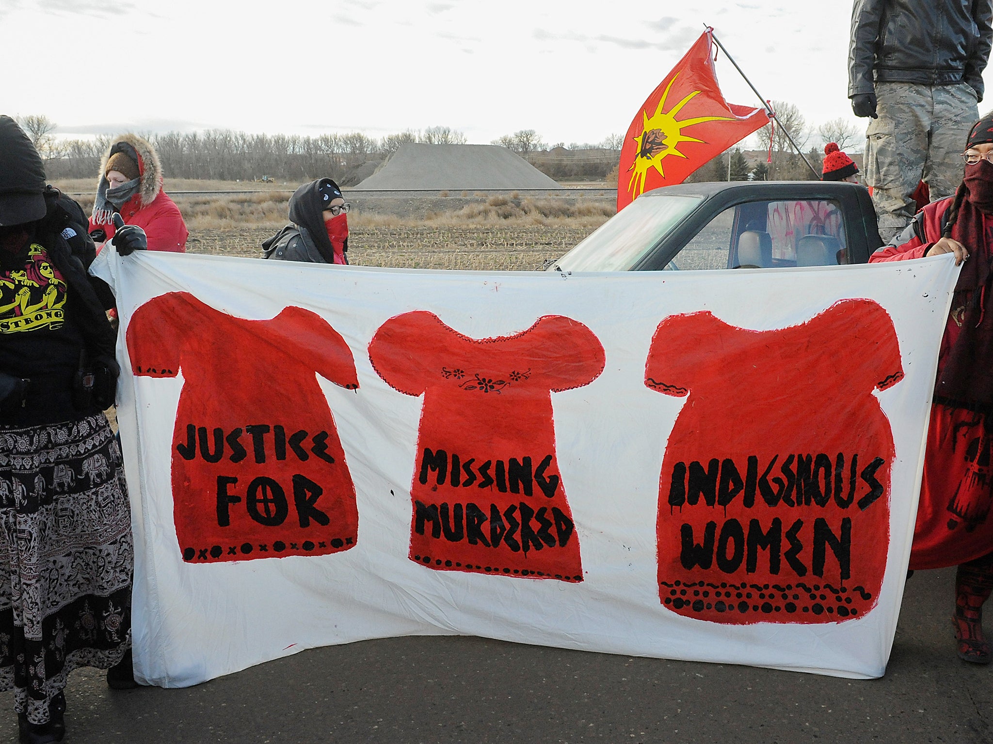 Protesters hold a banner in support of indigenous women during a protest in Mandan against plans to pass the Dakota Access pipeline near the Standing Rock Indian Reservation, North Dakota, U.S