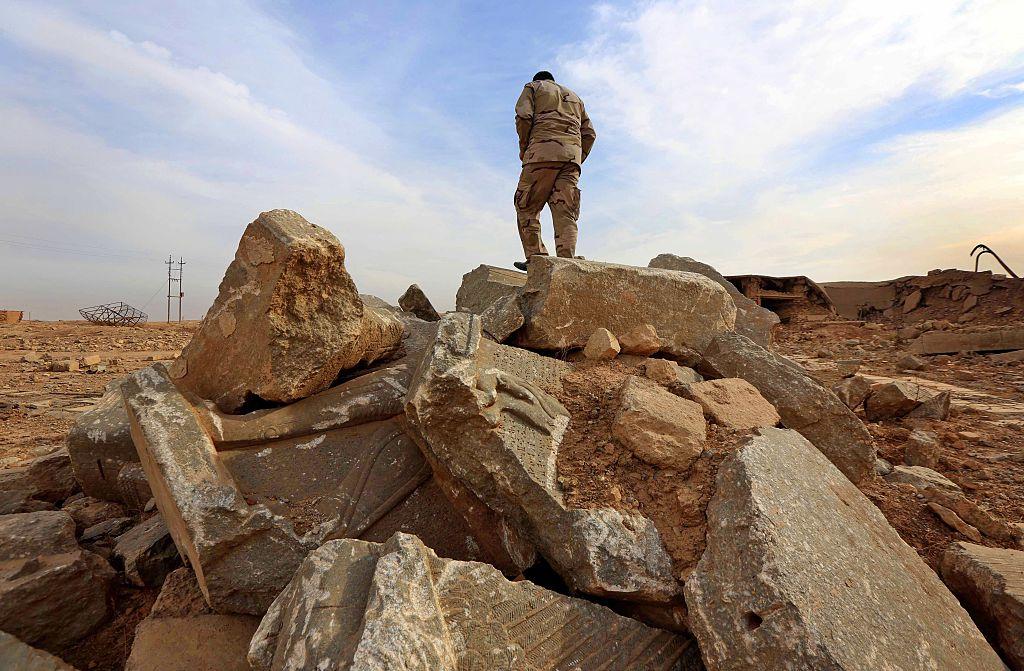 An Iraqi soldier stands among the ruins of Nimrud, pictured on 15 November