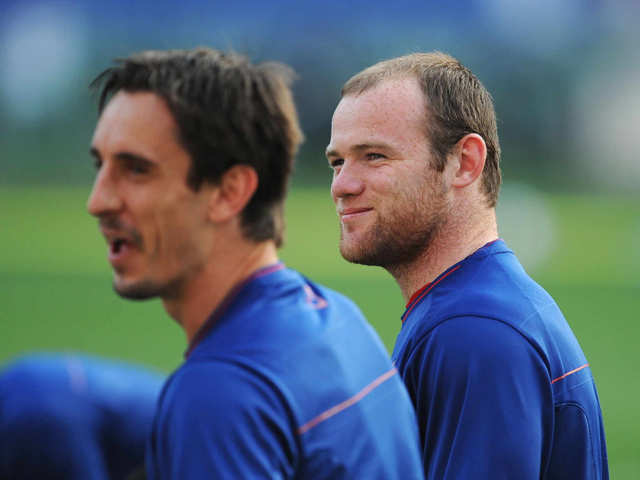 Neville and Rooney together during their days as team-mates in 2009