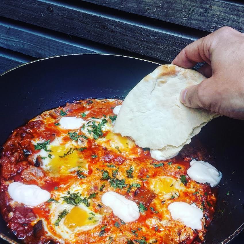 Tomato sauce is the key ingredient in Shakshuka, a hearty Middle Eastern poached eggs dish