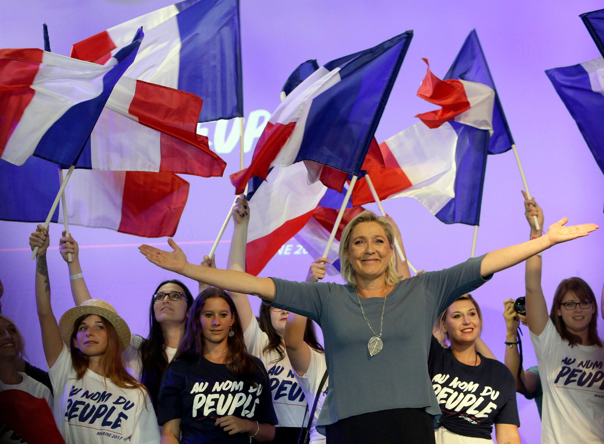 France's far-right Front National leader Marine Le Pen waves to supporters