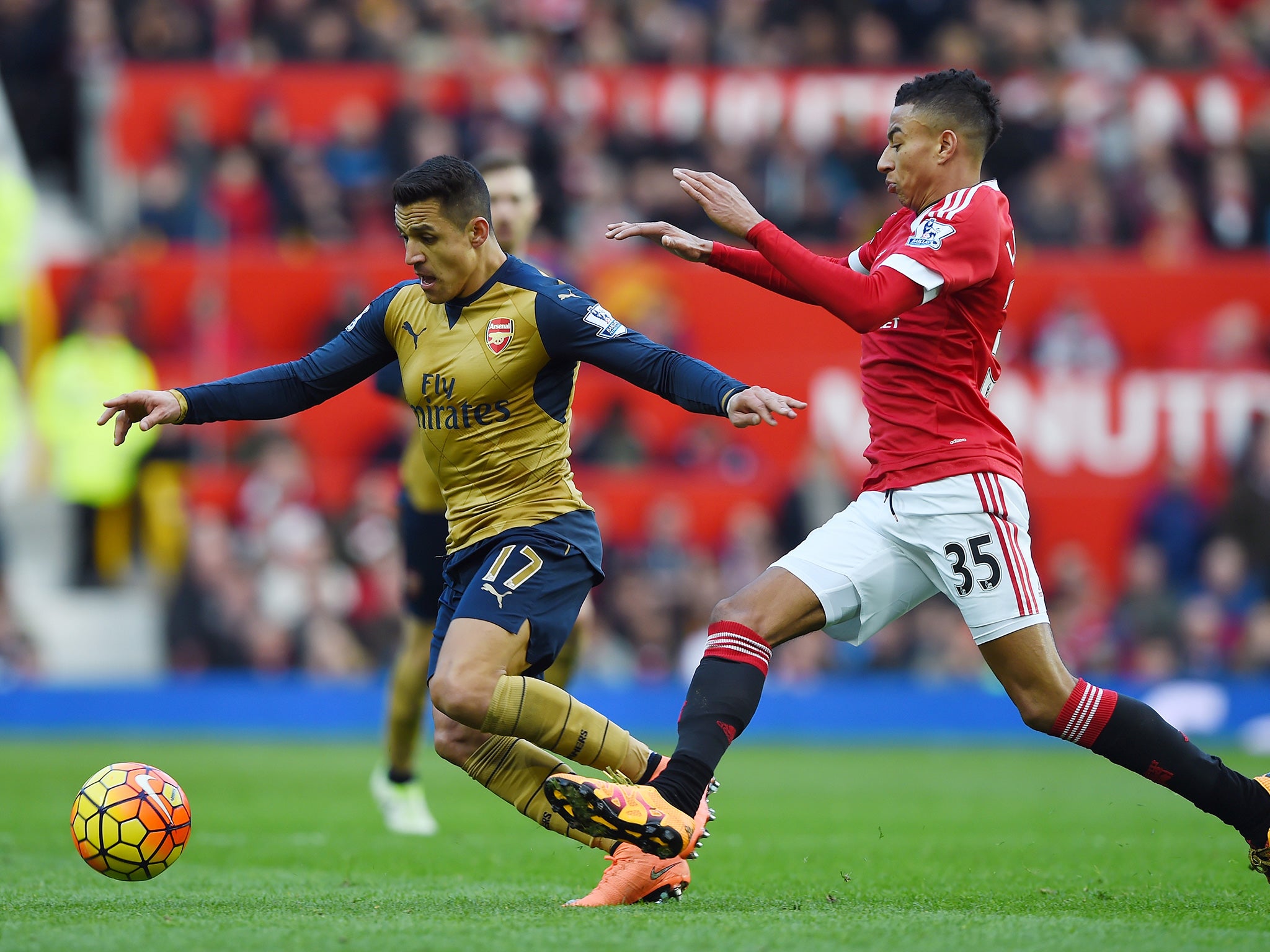 Alexis Sanchez and Jesse Lingard battle for the ball in last season's meeting
