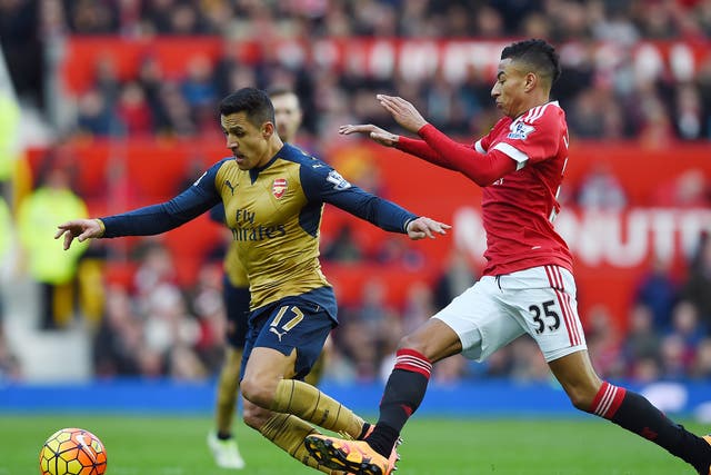 Alexis Sanchez and Jesse Lingard battle for the ball in last season's meeting