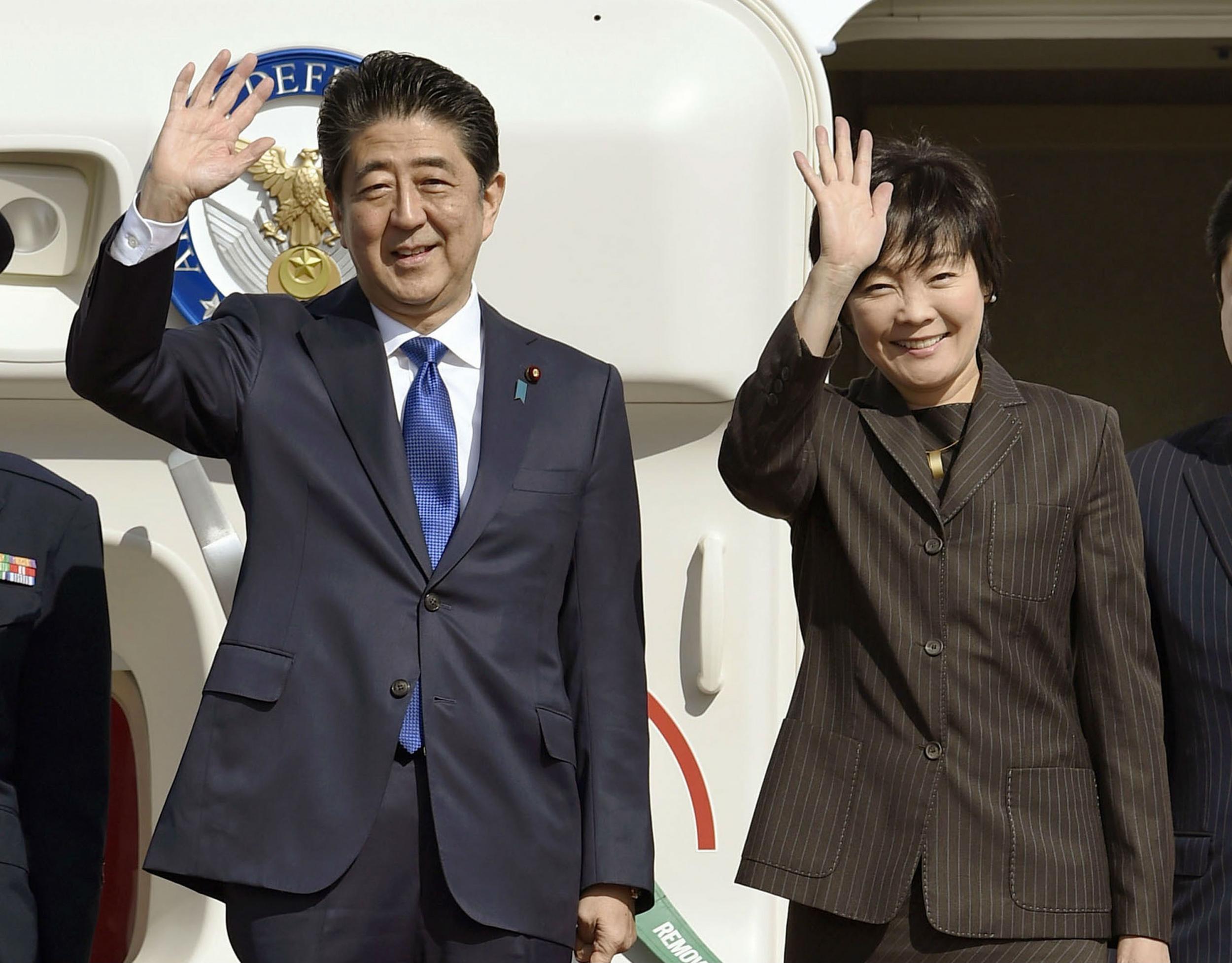 Prime Minister Shinzo Abe and his wife depart Tokyo for talks with President-elect Trump