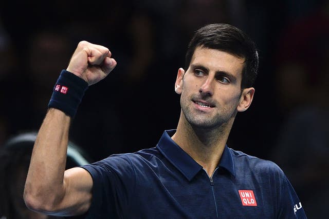 Novak Djokovic celebrates his victory over David Goffin at the ATP Tour finals
