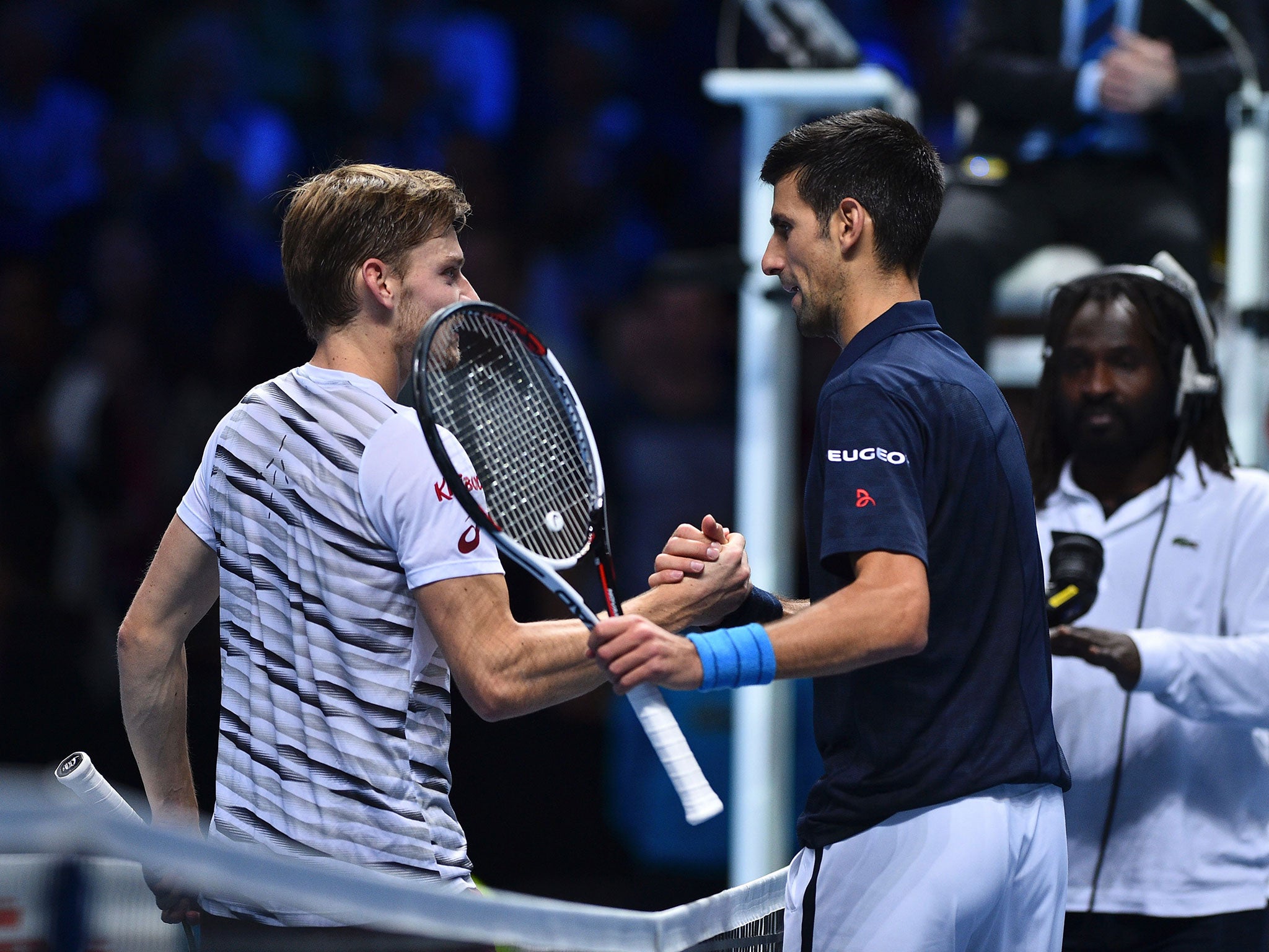 Djokovic and Goffin shake hands after their group match at the ATP World Tour Finals