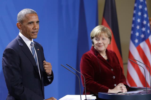 Mr Obama praised Ms Merkel as an 'outstanding partner' at their Berlin press conference, suggesting he would vote for her if he were German