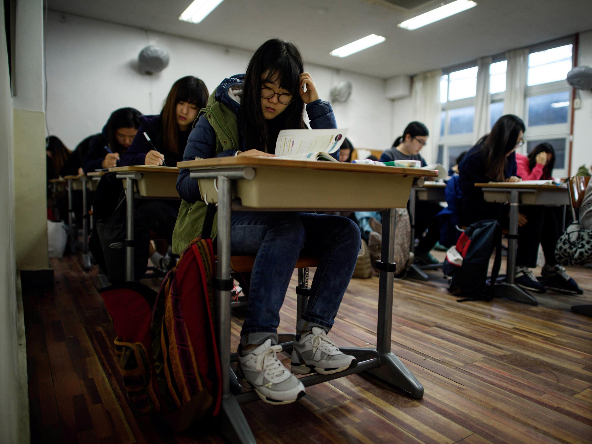 Students sit the annual Scolastic Aptitude Test at a the Poongmun high school in Seoul